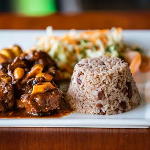 a plate of food with rice and meat