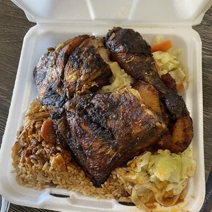 Jerk chicken, rice and peas, and steam cabbage. Also plantains