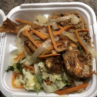 Fried Medium Red Snapper with rice and beans and sautéed cabbage