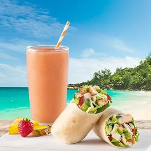 a glass of smoothie and two burritos