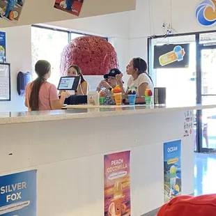 customers at the counter of a fast food restaurant