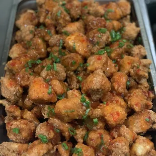 a tray of food with meat and vegetables