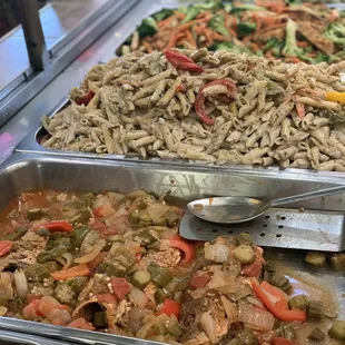 a variety of food in a buffet