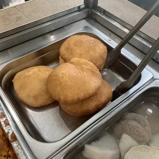 a variety of pastries in a display case