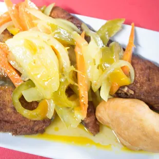 a plate of food on a red table