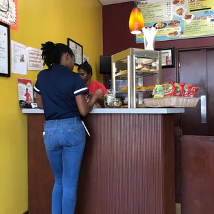 a woman ordering food at a fast food restaurant