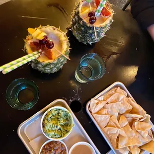 Two Whole Piñas with Chips and Chips Guacamole and Salsas