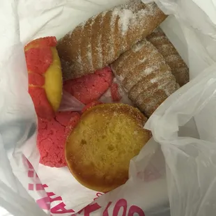 Small conchas, small pink cookies and 3 long breads for $3 bucks
