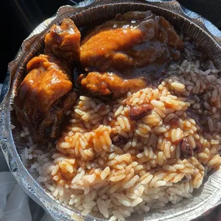 a plate of rice and chicken