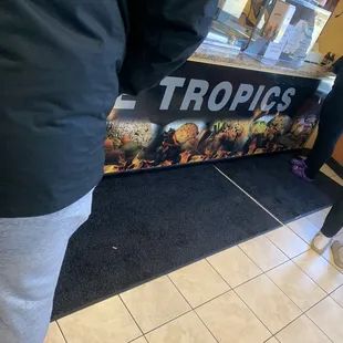 a man standing in front of a counter