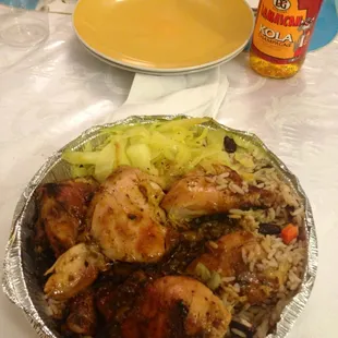 LARGE jerk chicken that comes with rice, black beans and cabbage all for $10. This meal can be for two people.