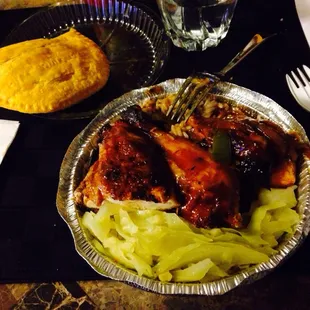 Juicy Jerk Chicken with sweet/very spicy jerk sauce, rice n peas, and side veggie..+ beef patty
