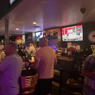 people sitting at the bar