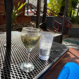 Hanging out at the tables outside the bar