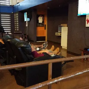 two people sitting in recliners