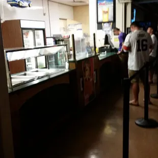 a line of customers waiting to order food