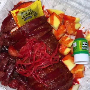 Bandeja Loca, tamarind covered apples + candy and mango pieces