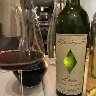 a bottle of wine and a glass of wine