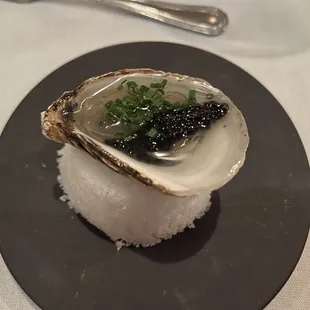 5 Course Tasting Menu (December 2023): New Brunswick oyster garnished with chive and caviar