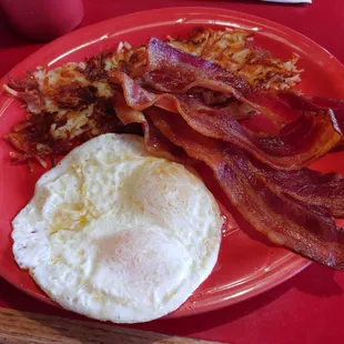 Bacon and eggs over easy crispy hash browns