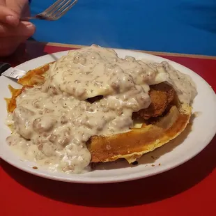 Chicken awful. Bacon waffle topped with syrup, chicken fried steak, 2 eggs, and sausage gravy. SO good!