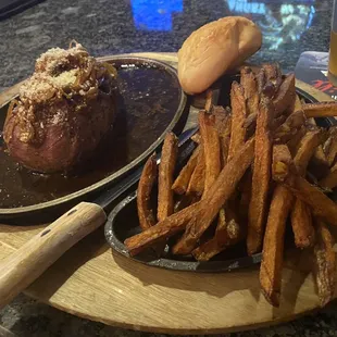 a steak and fries on a plate