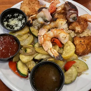 Gulf shrimp sampler with veggies and rice.