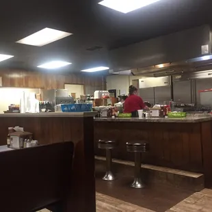 a restaurant kitchen with people preparing food