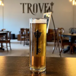 a glass of beer on a table