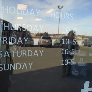 Hours of operation, front entry door.