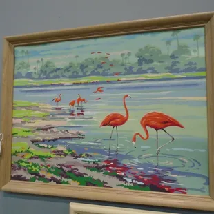 A vintage paint-by-numbers flamingo painting.