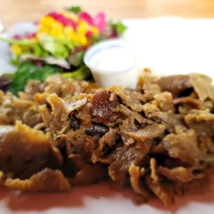 a plate of meat and vegetables