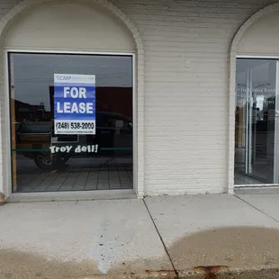 a for lease sign in a window