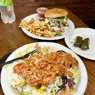 Chicken Istanbul salad bowl, stuffed grape leaves, and Farmer's Burger &amp; fried potato