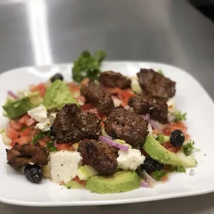 Lamb kebab on salad