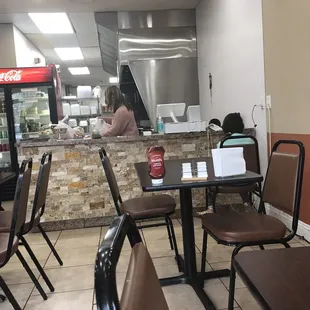 a restaurant with tables and chairs