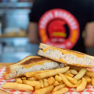 a grilled sandwich and french fries