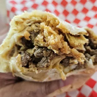 Carne Asada Breakfast Burrito.  They use rice and beans instead of potatoes.