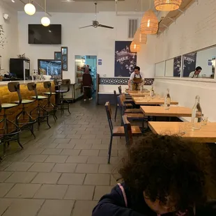 Inside, restrooms in the distance