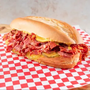 We got the best pastrami in town. Served hot on a fresh french roll with pickles and mustard.