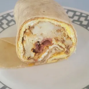 Been coming here nearly 20 years.   The amount of bacon in my burrito is embarrassing.