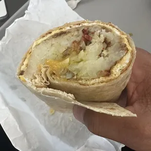 Bacon and sausage breakfast burrito (cut down the middle).