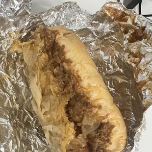 Jumbo chili dog with sauerkraut and brown mustard