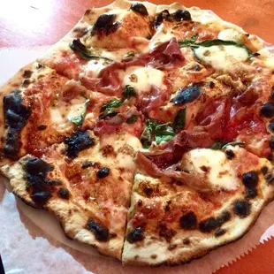 &quot;Light&quot; + crushed tomatoes = prosciutto, mozzarella, basil, parm, sea salt (they forgot the arugula)