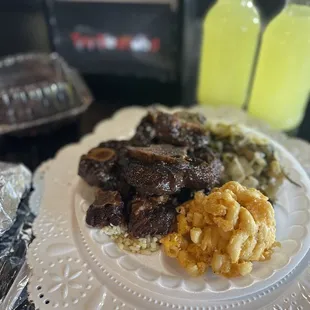 Ox tails and rice Mac and cheese and cabbage, their Tru Lemonade and Chocolate Cake