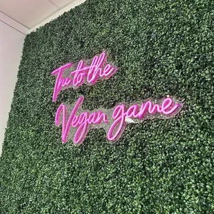 a neon sign on a wall