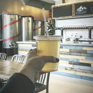 a person holding a cup of coffee