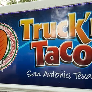 taco truck parked on the side of the road