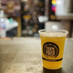 a cup of beer on a table