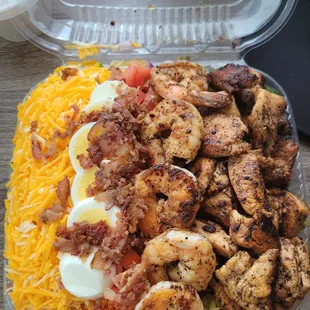 Have Mercy Salad with grilled chicken and Shrimp. Also had pickles,  red onions, eggs, bacon, tomatoes and cheese.